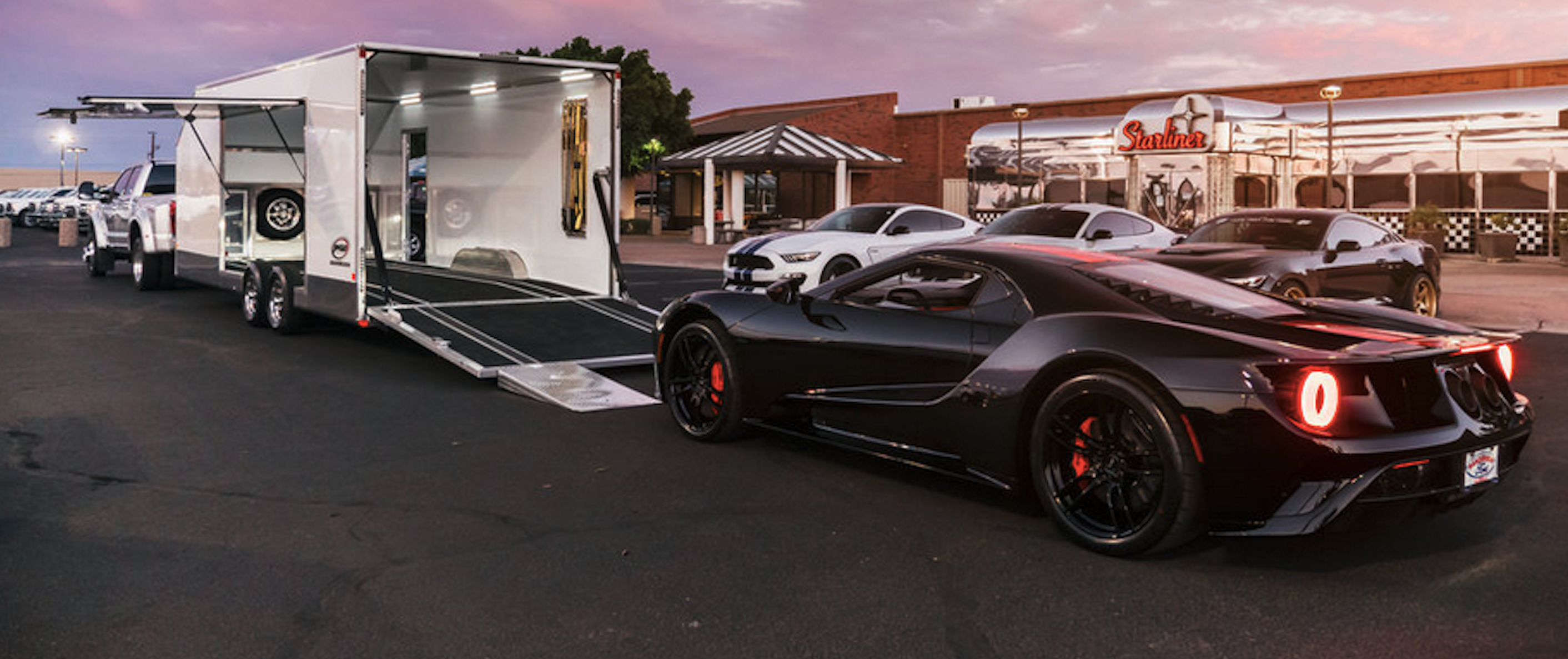 Steeda Mustang Bullitt loading onto JIMGLO open car trailer